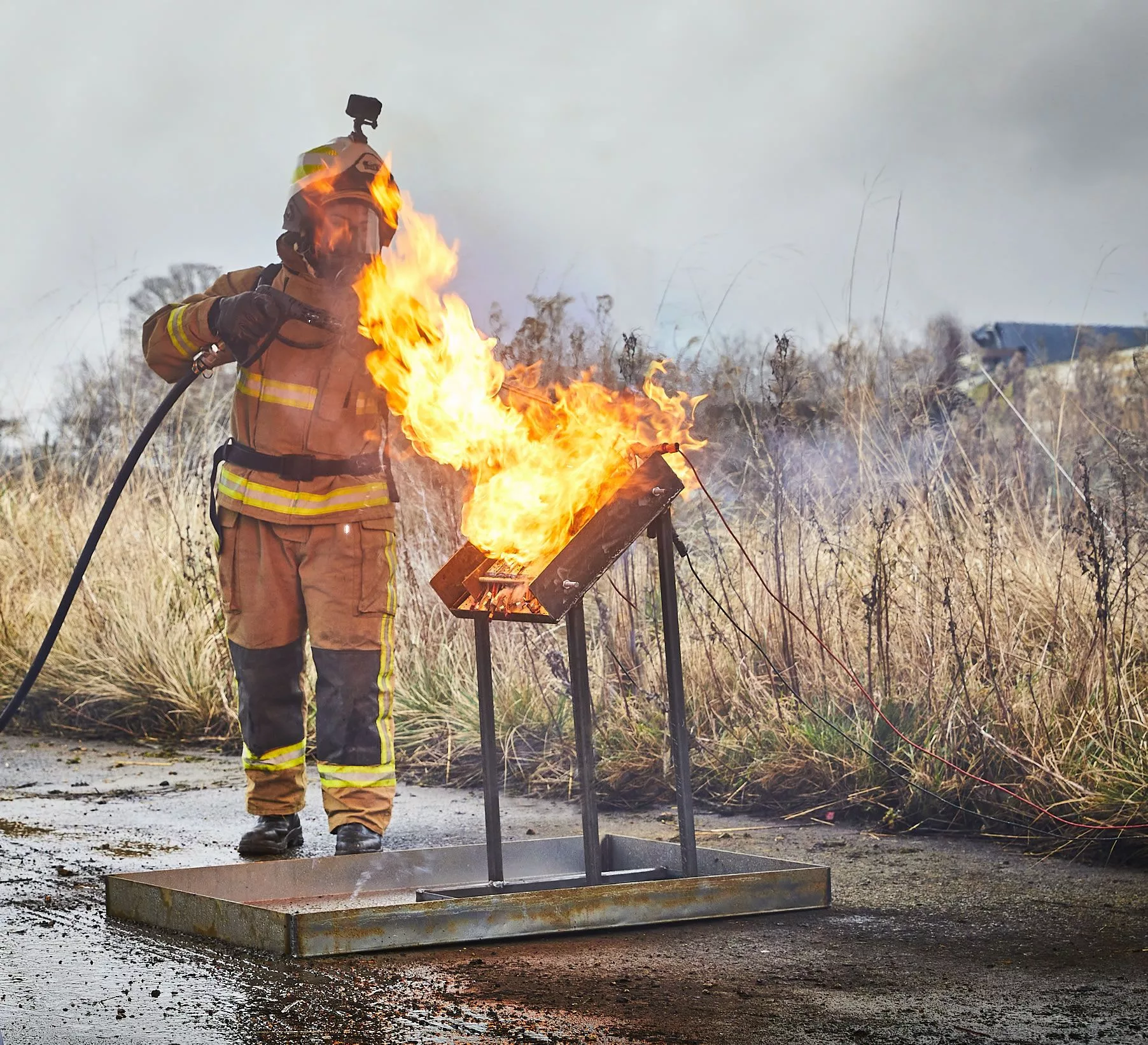 Firefighter putting out lithium battery fire